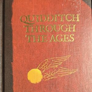 Quidditch Through the Ages Book - Red and Gold Cover